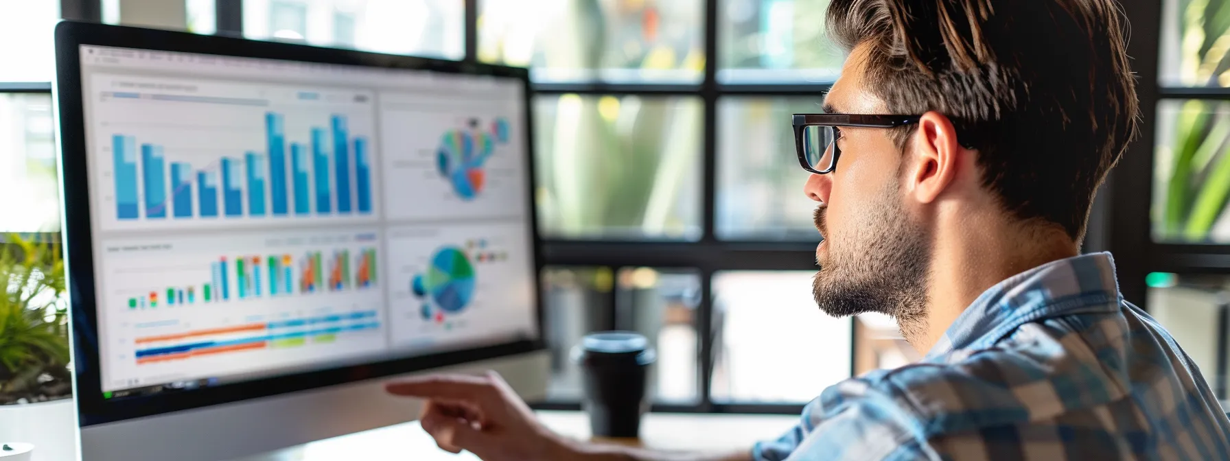 a focused marketer analyzing data on a computer screen to target the audience with precision.